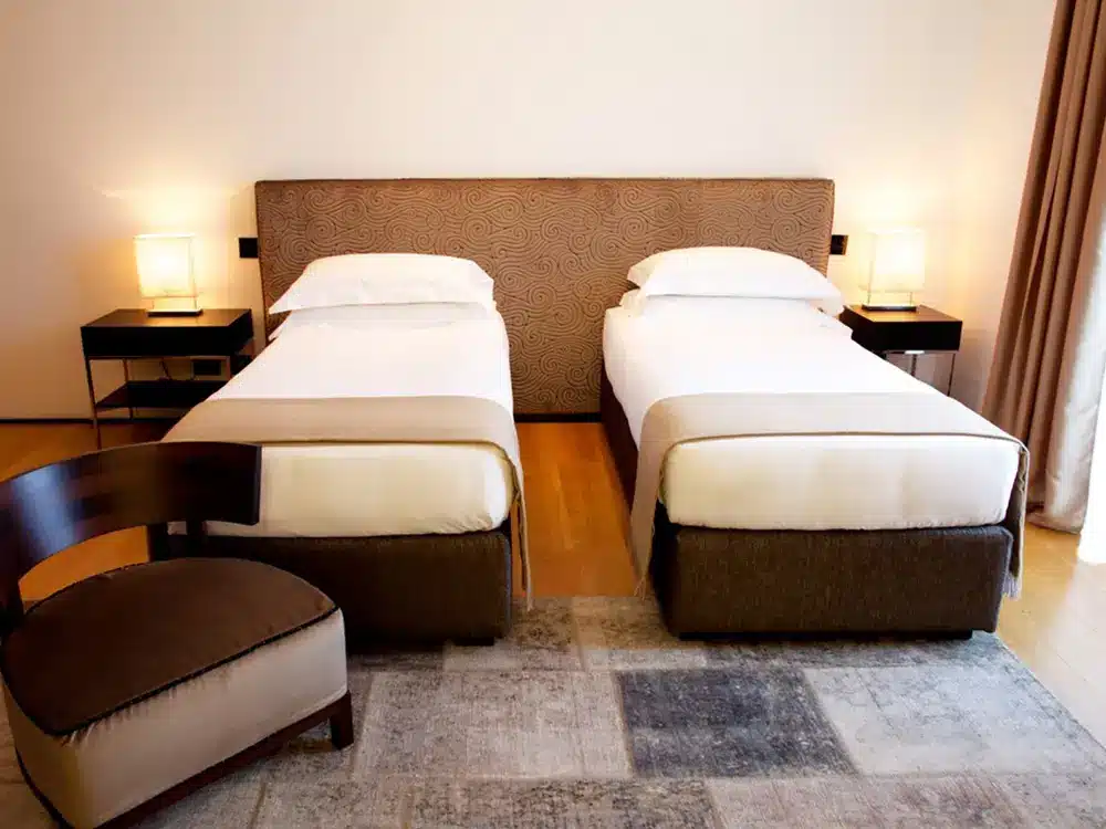 For the luxury hotel in Forte dei Marmi, customised bed headboards were made and fully compliant with current hôtellerie regulations