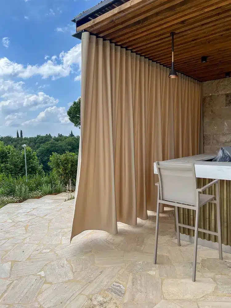 Outdoor blinds made by Zefiro Interiors for the outdoor areas of the hotel Toscana Resort Castelfalfi